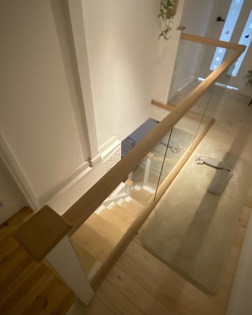 newly installed glazed and oak bannister