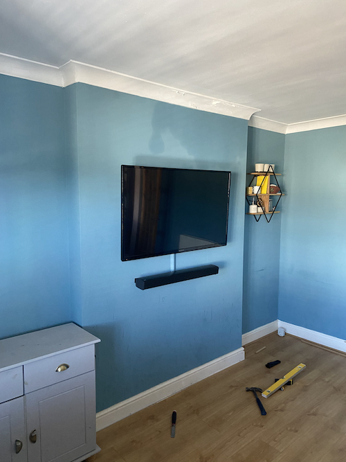 media unit built around wall mounted TV