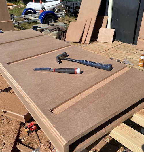 Chiselling the frame for shop shelving