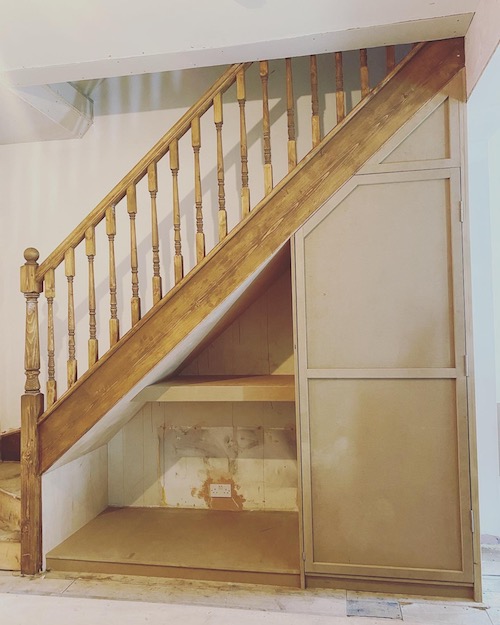 under-stair cupboard with dog beds